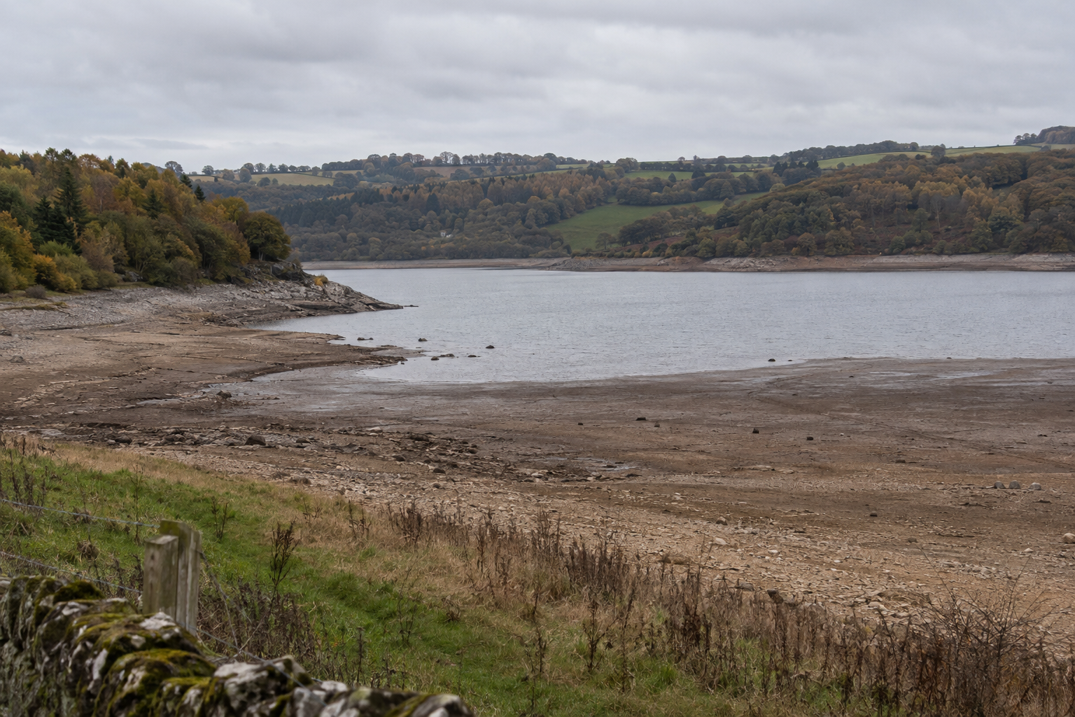 Exposed banks around Wimbleball reservoir in Somerset illustrate low water levels during the England drought.